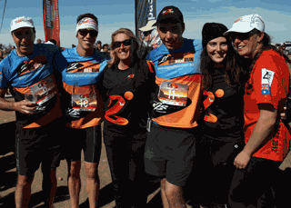 The Donovan family celebrate at the finish of the inaugural Big Red Run, outside the Birdsville Pub.
