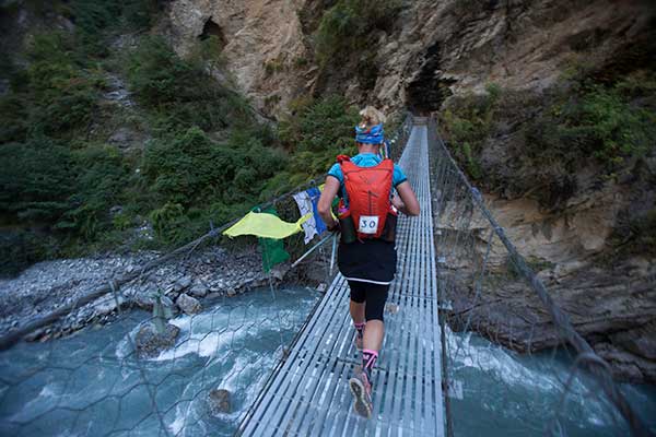 1 Here's Marta Poretti (IT) traversing one of the many suspension bridges which criss-cross the route.